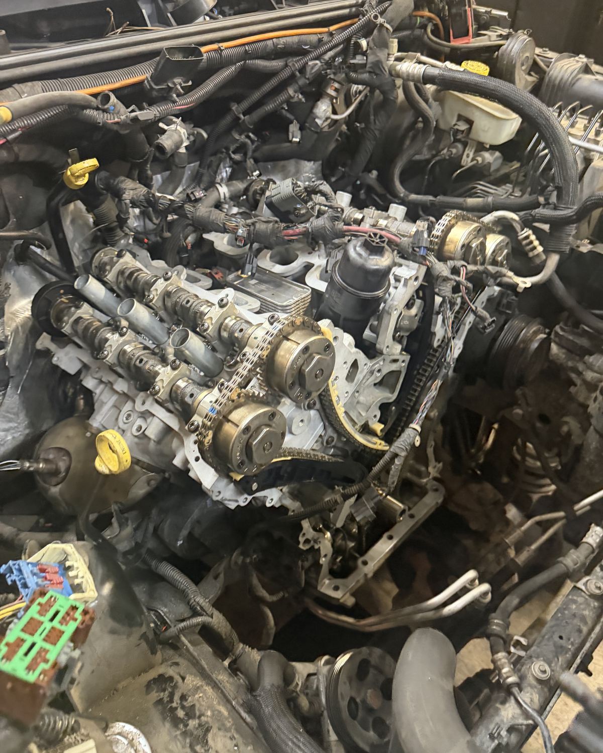 An engine with its timing components exposed during a repair at Ronnie’s Automotive